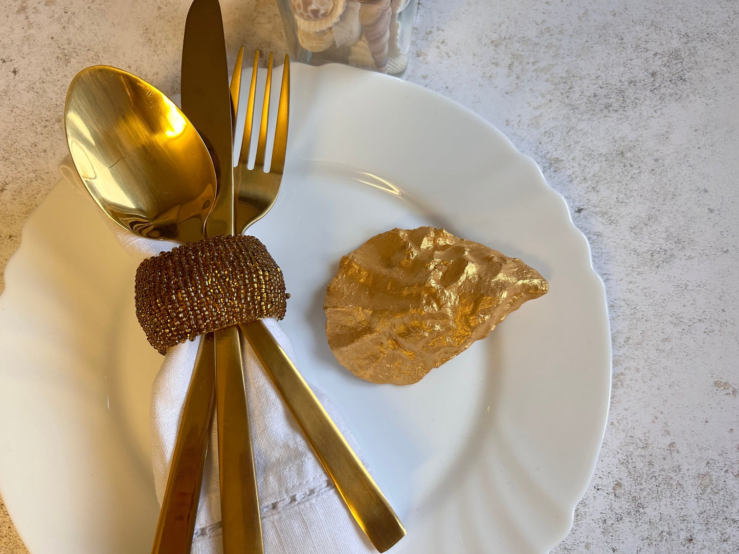 Gold Oyster Shell Wedding Favours And Place Cards.