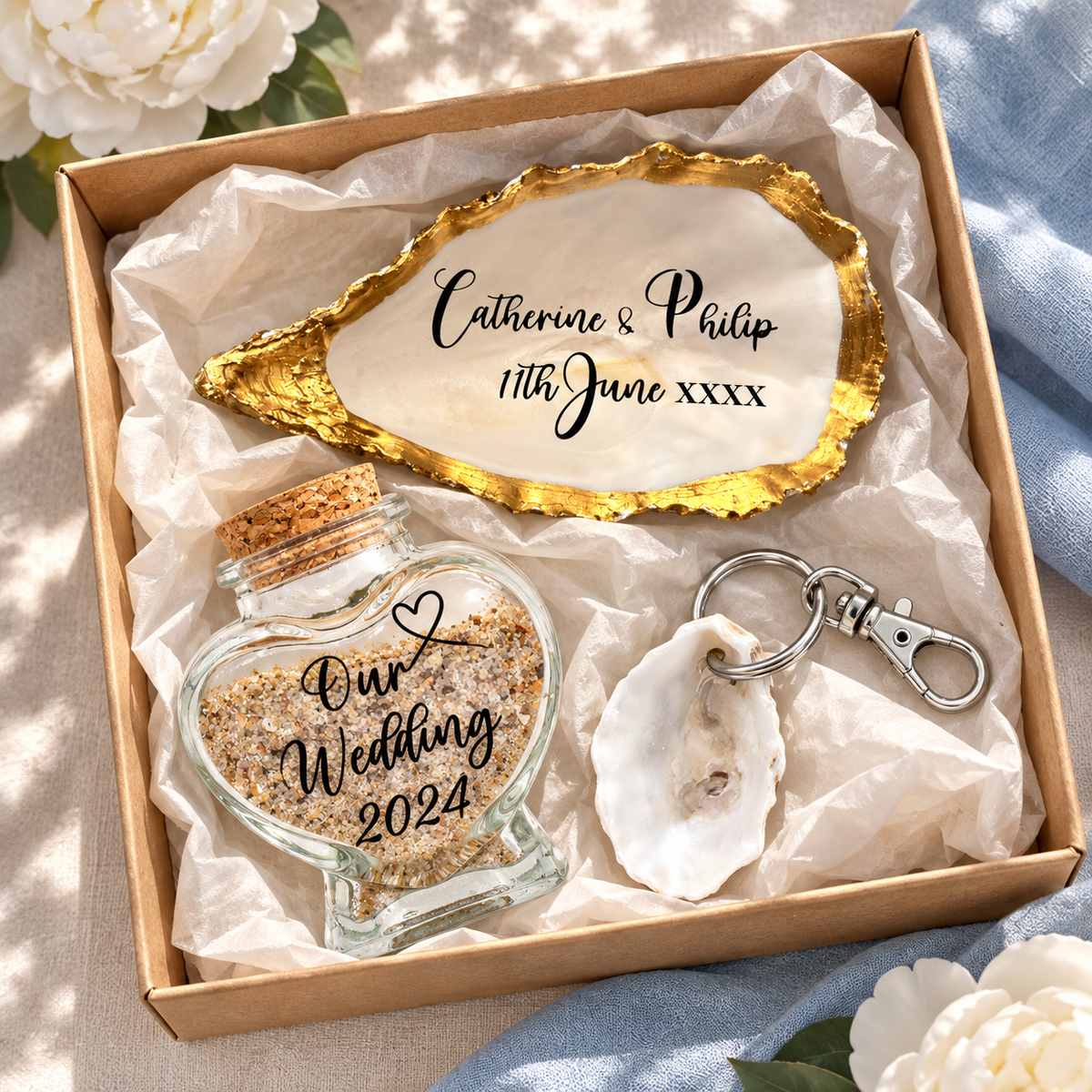 Wedding keepsake gift set with heart sand bottle, oyster shell cake topper and shell keyring