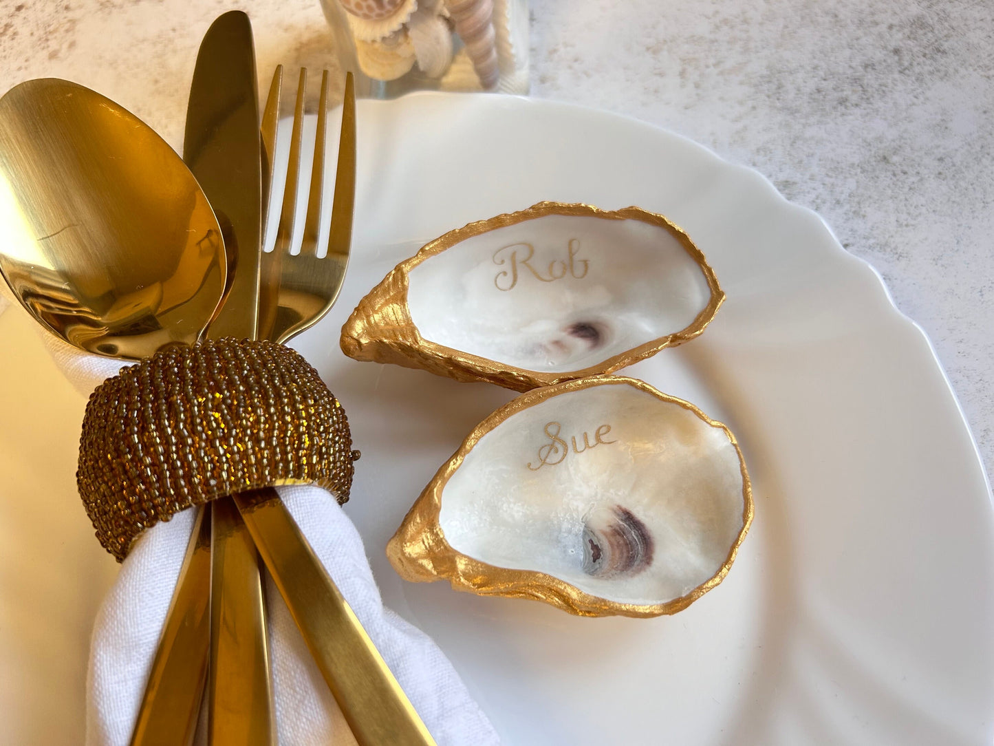 Gold Oyster Shell Wedding Favours And Place Cards.