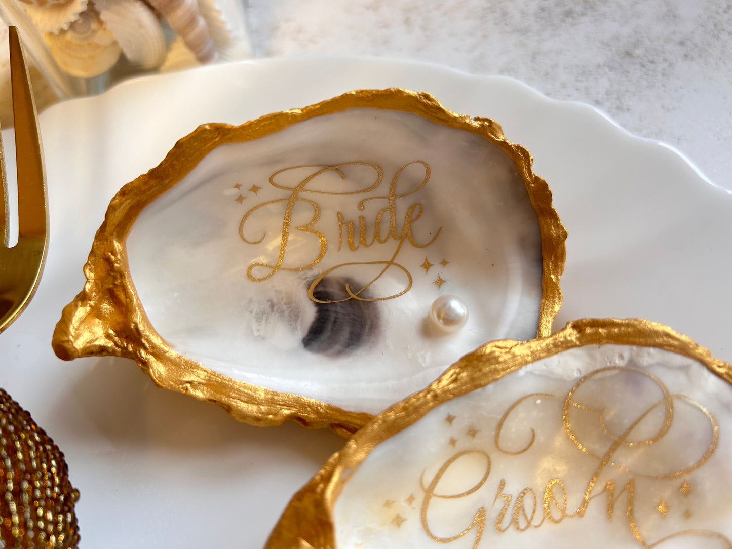 Gold Oyster Shell Wedding Favours And Place Cards.