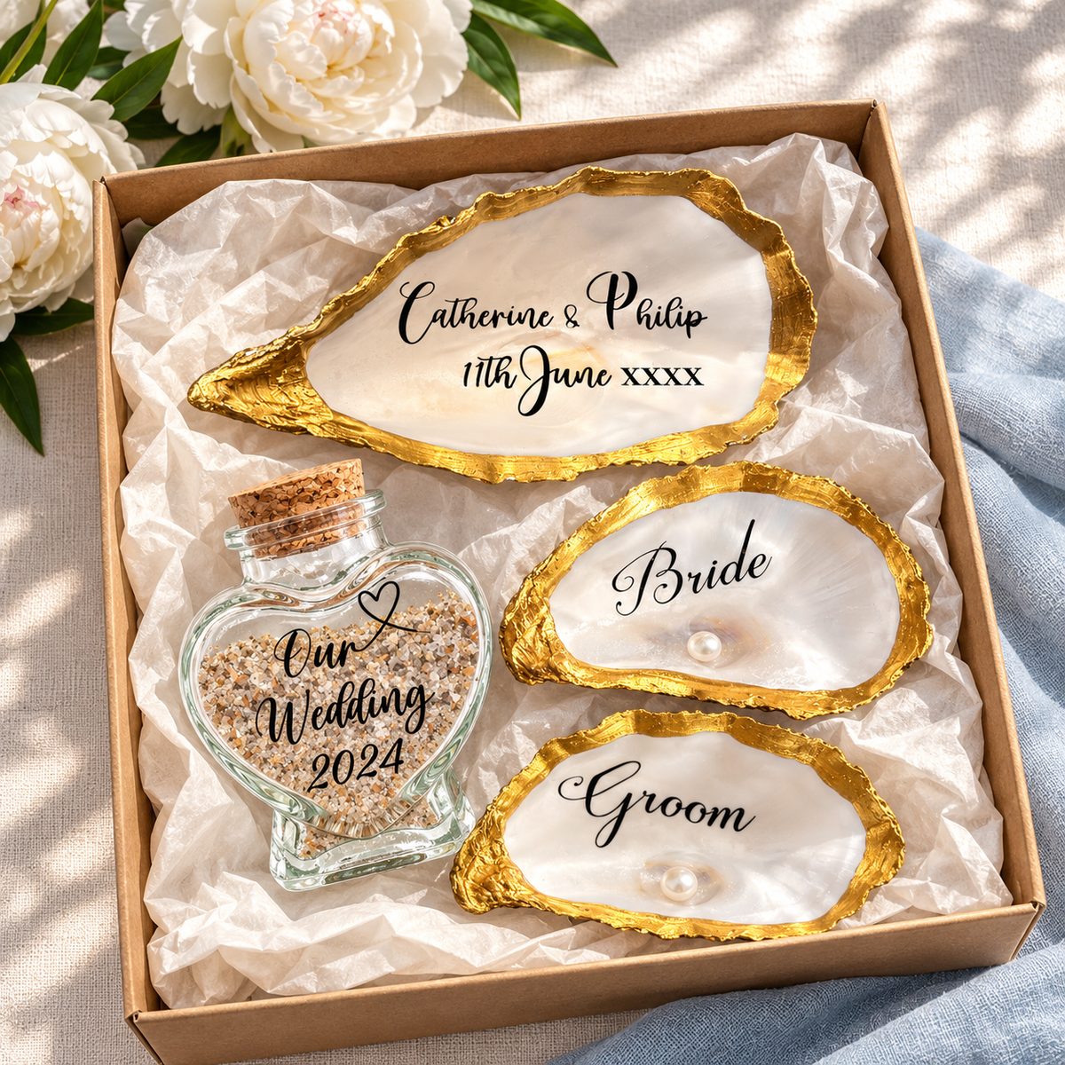 Bride and Groom wedding keepsake set with heart sand bottle, oyster shell cake topper and pearl place names
