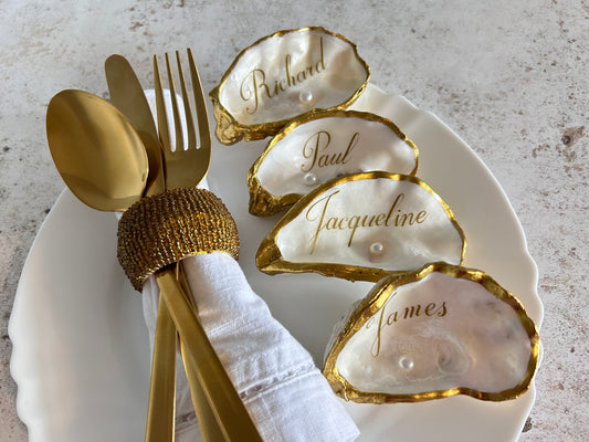 Antique gold oyster shell wedding name cards.