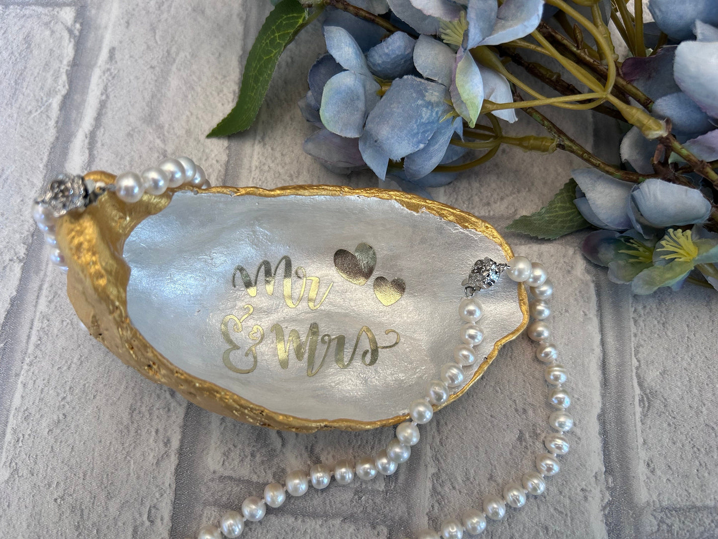 Mr and Mrs gold oyster shell ring dish.