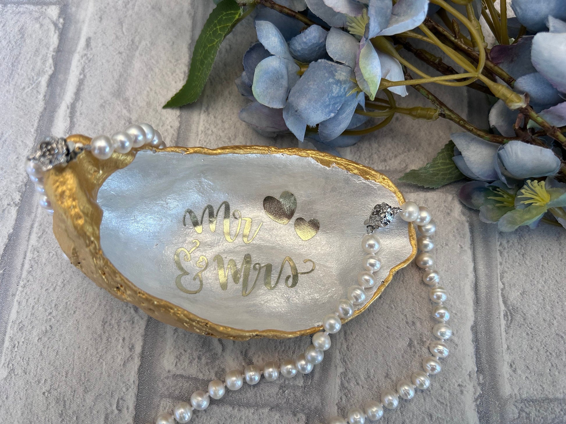 Mr and Mrs gold oyster shell ring dish.