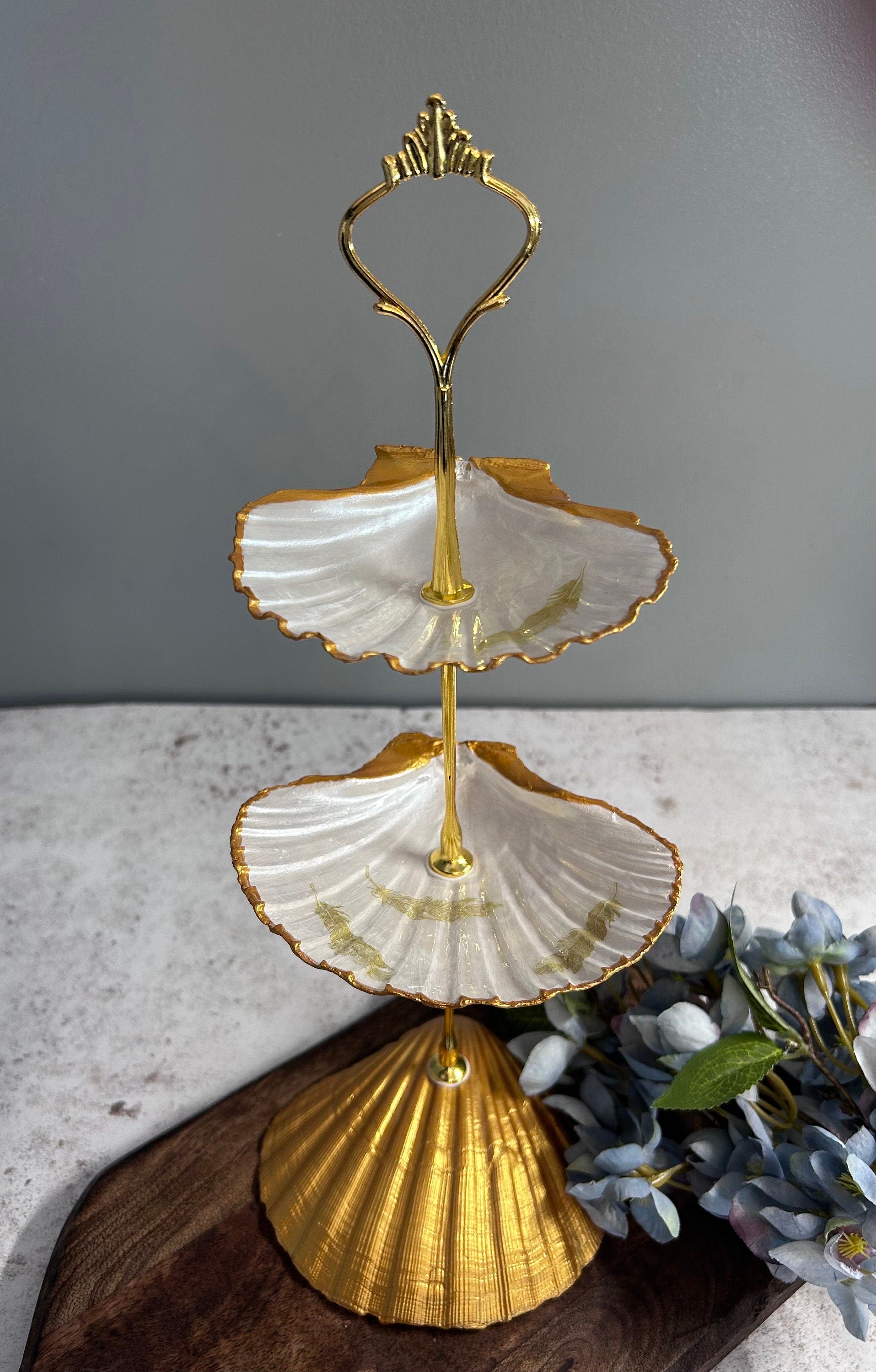 Gold scallop shell jewellery stand with feather design. Two tier jewellery display gift for her. Bedside ring, earring and necklace holder.