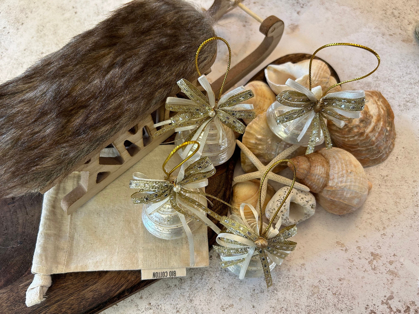 Pearlescent shell hanging decoration. Natural Trochus spiral shell bauble. Mother of Pearl and gold glitter door decor. Fisherman aesthetic