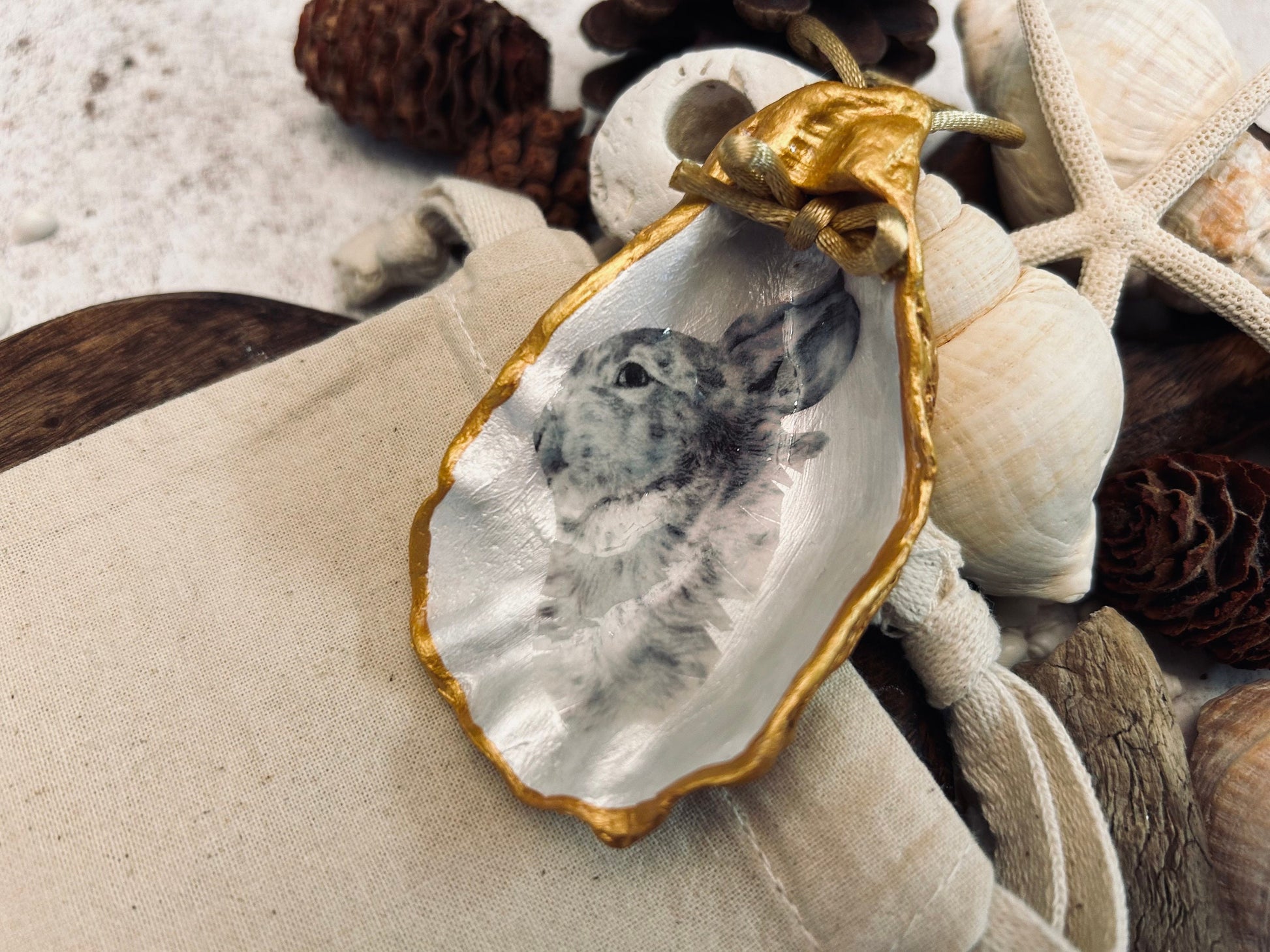 Hare portrait oyster shell in rich gold. Easter gift for hare lovers. Black and gold hare hanging ornament. Wildlife animal gift.