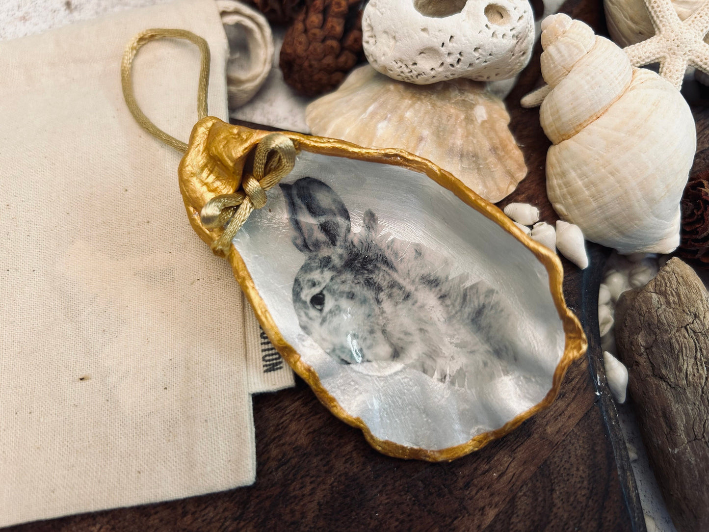 Hare portrait oyster shell in rich gold. Easter gift for hare lovers. Black and gold hare hanging ornament. Wildlife animal gift.