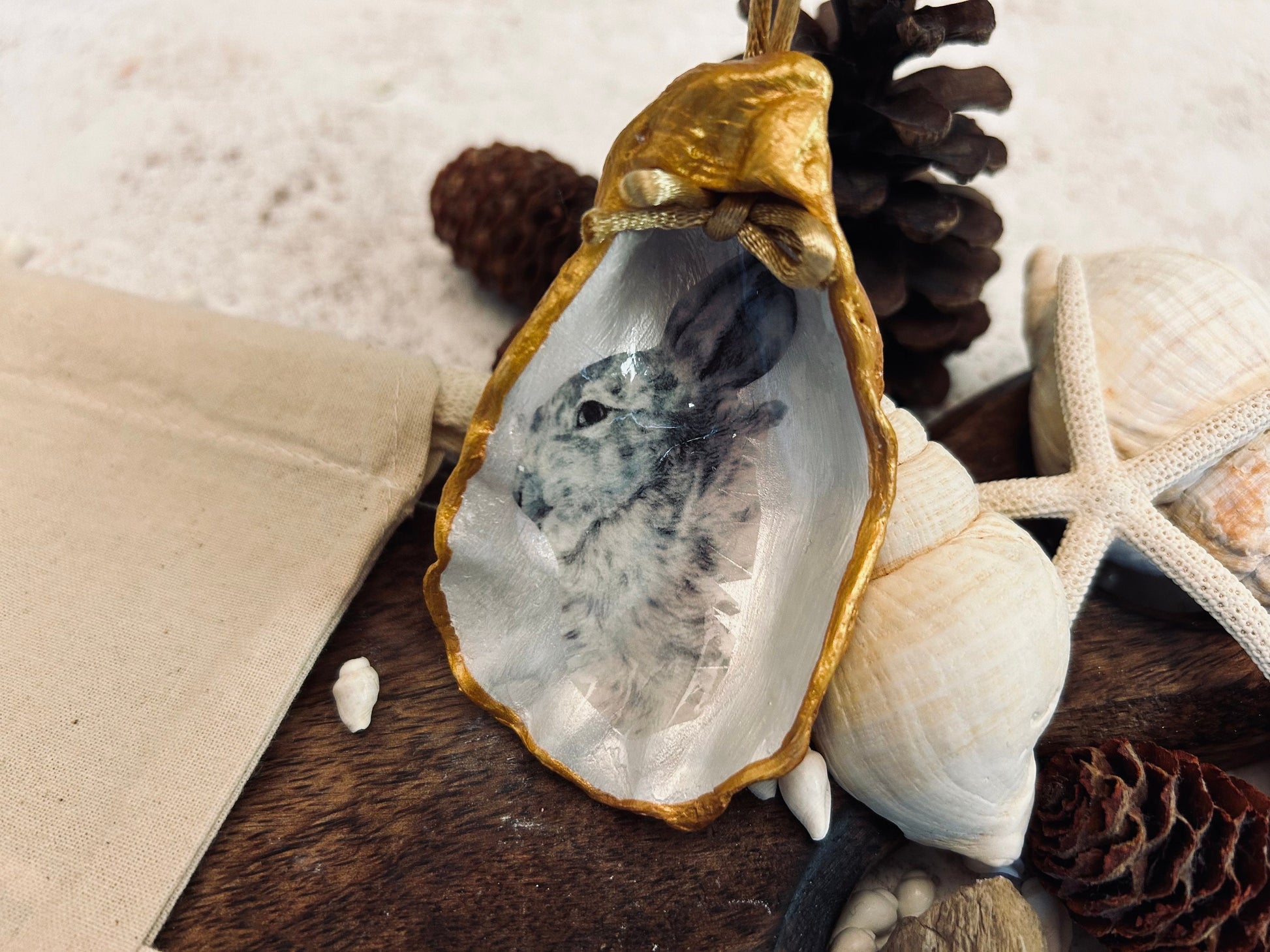 Hare portrait oyster shell in rich gold. Easter gift for hare lovers. Black and gold hare hanging ornament. Wildlife animal gift.