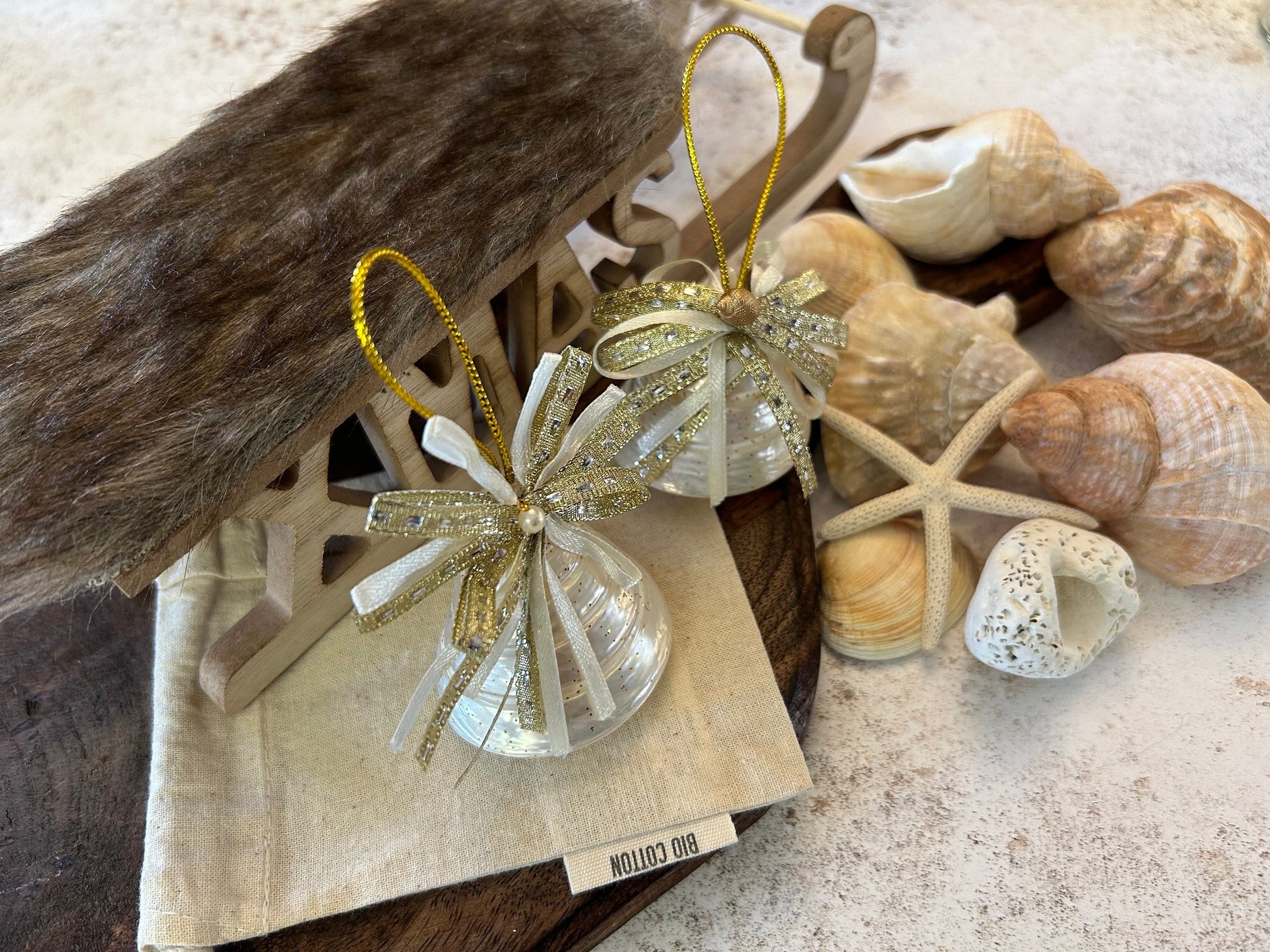 Pearlescent shell hanging decoration. Natural Trochus spiral shell bauble. Mother of Pearl and gold glitter door decor. Fisherman aesthetic