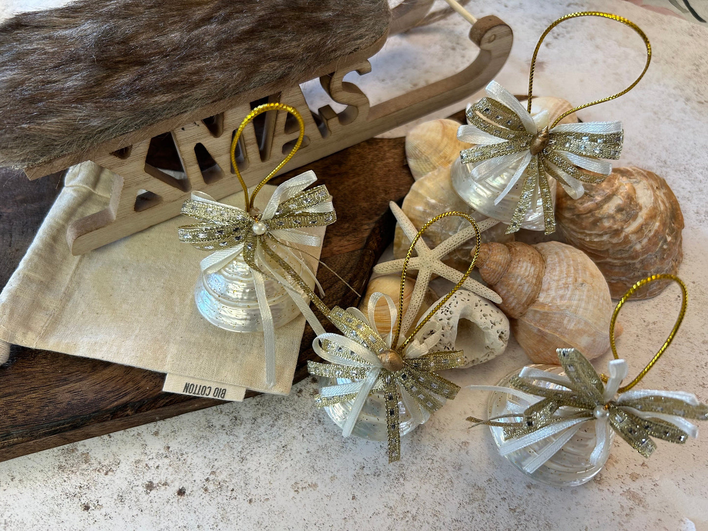 Pearlescent shell hanging decoration. Natural Trochus spiral shell bauble. Mother of Pearl and gold glitter door decor. Fisherman aesthetic