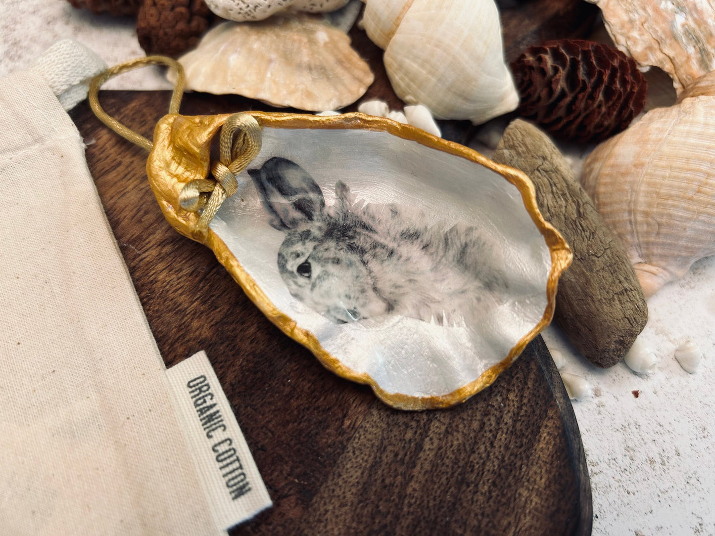 Hare portrait oyster shell in rich gold. Easter gift for hare lovers. Black and gold hare hanging ornament. Wildlife animal gift.