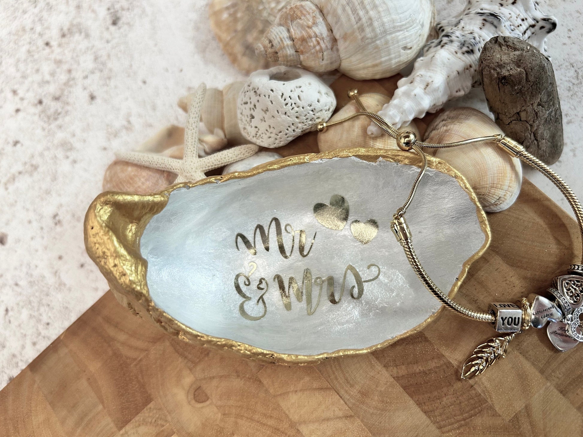 Mr and Mrs gold oyster shell ring dish.