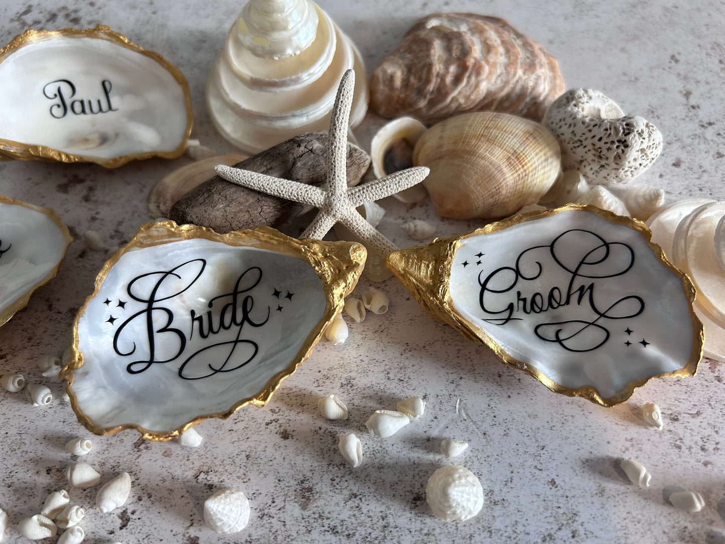 Personalised oyster shell place card. Wedding place names and favours. Natural inside with custom colours. Destination or beach wedding.
