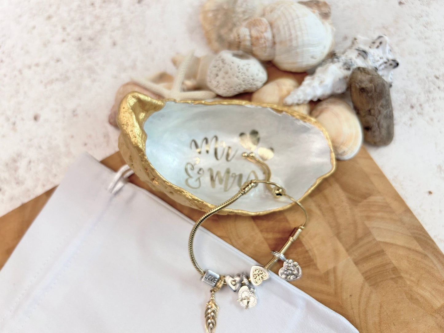 Mr and Mrs gold oyster shell ring dish.
