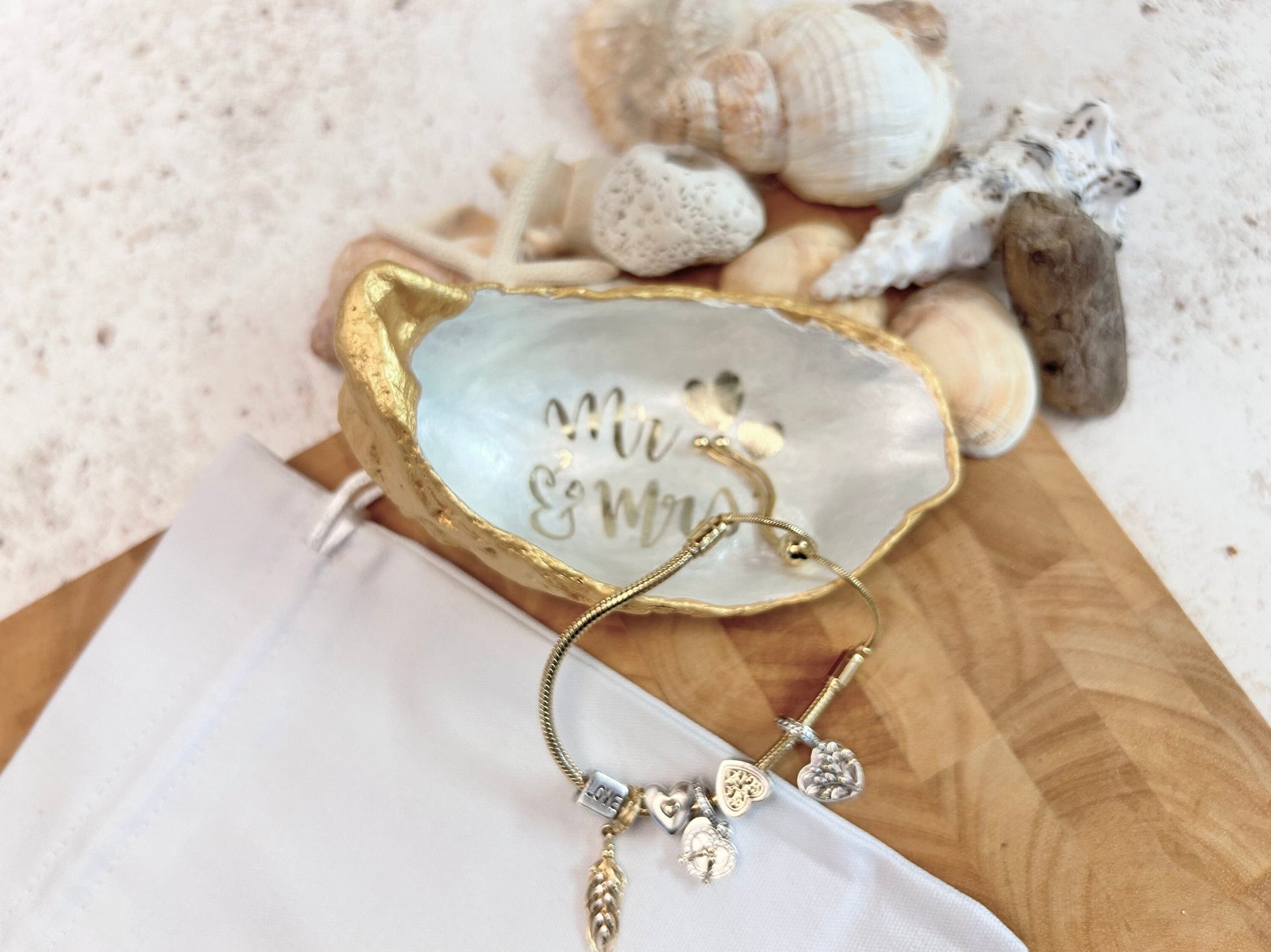 Mr and Mrs gold oyster shell ring dish.