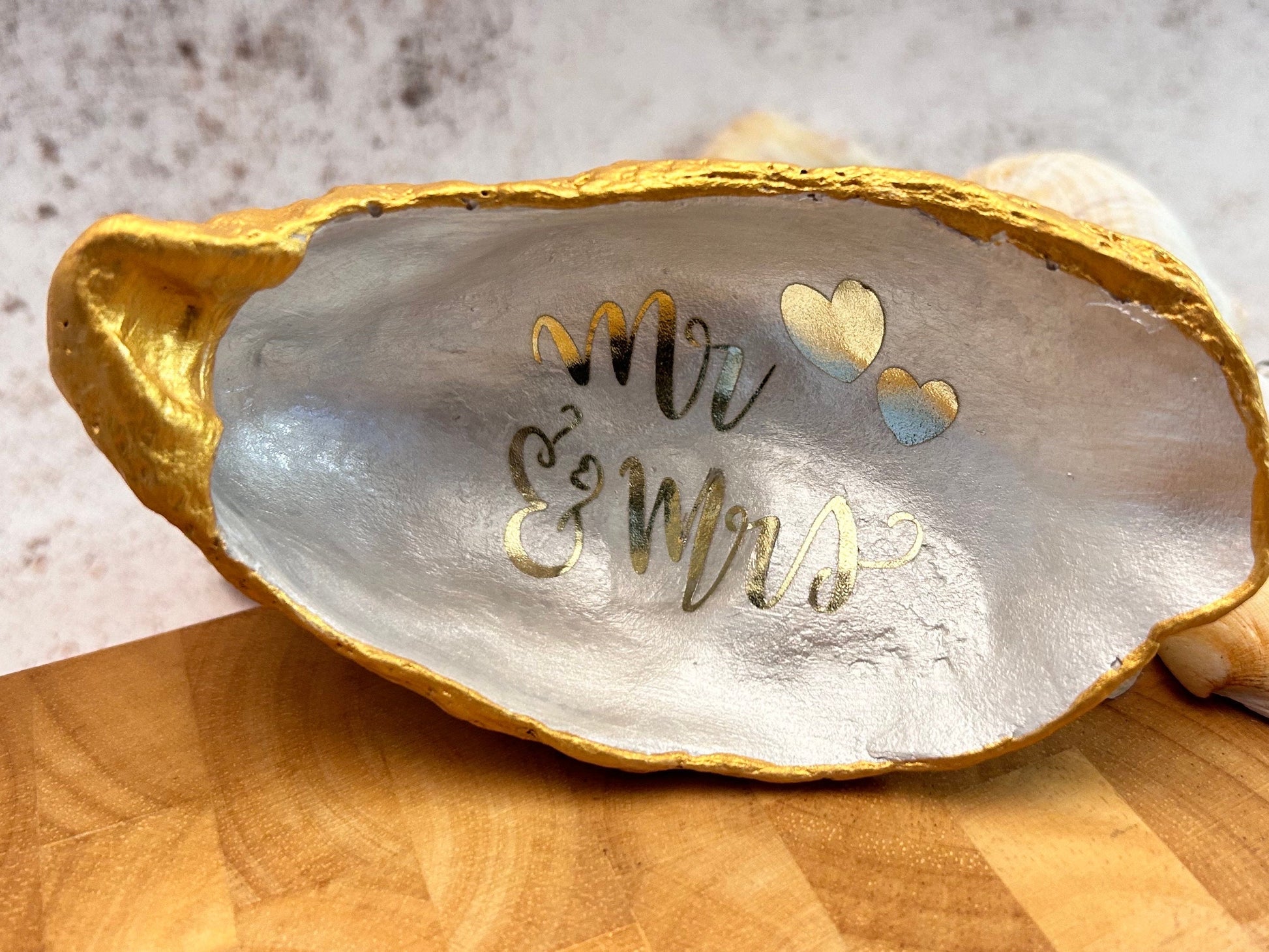 Mr and Mrs gold oyster shell ring dish.