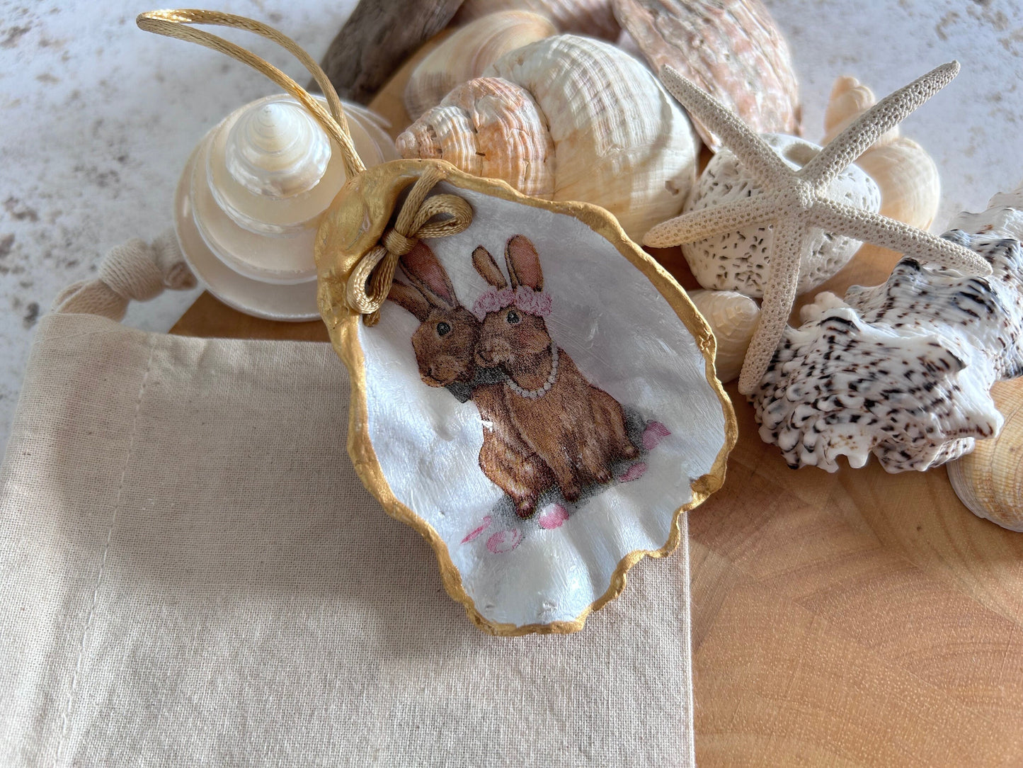 Easter Hare oyster shell hanging decoration. Brown bunny rabbit couple ornament.