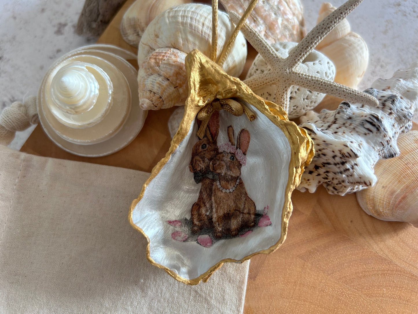 Easter Hare oyster shell hanging decoration. Brown bunny rabbit couple ornament.