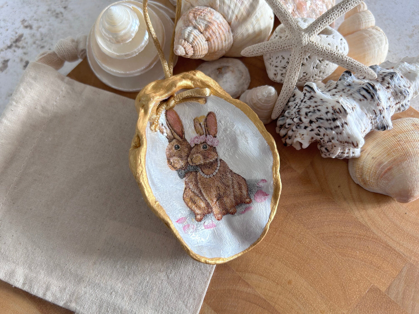 Easter Hare oyster shell hanging decoration. Brown bunny rabbit couple ornament.