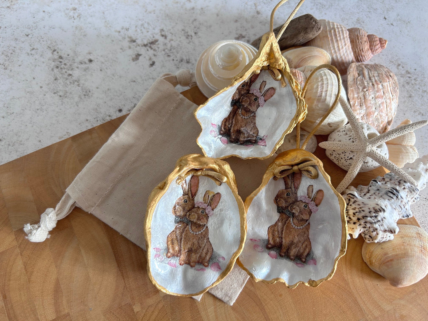 Easter Hare oyster shell hanging decoration. Brown bunny rabbit couple ornament.