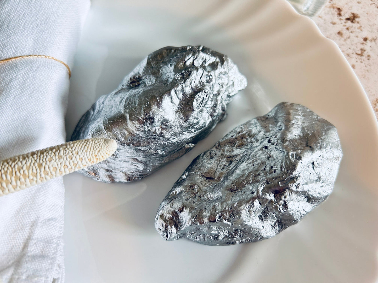 Oyster Shell Wedding Place Card and Favour. Personalised place names for your beach wedding decor. Silver coastal shell place settings.