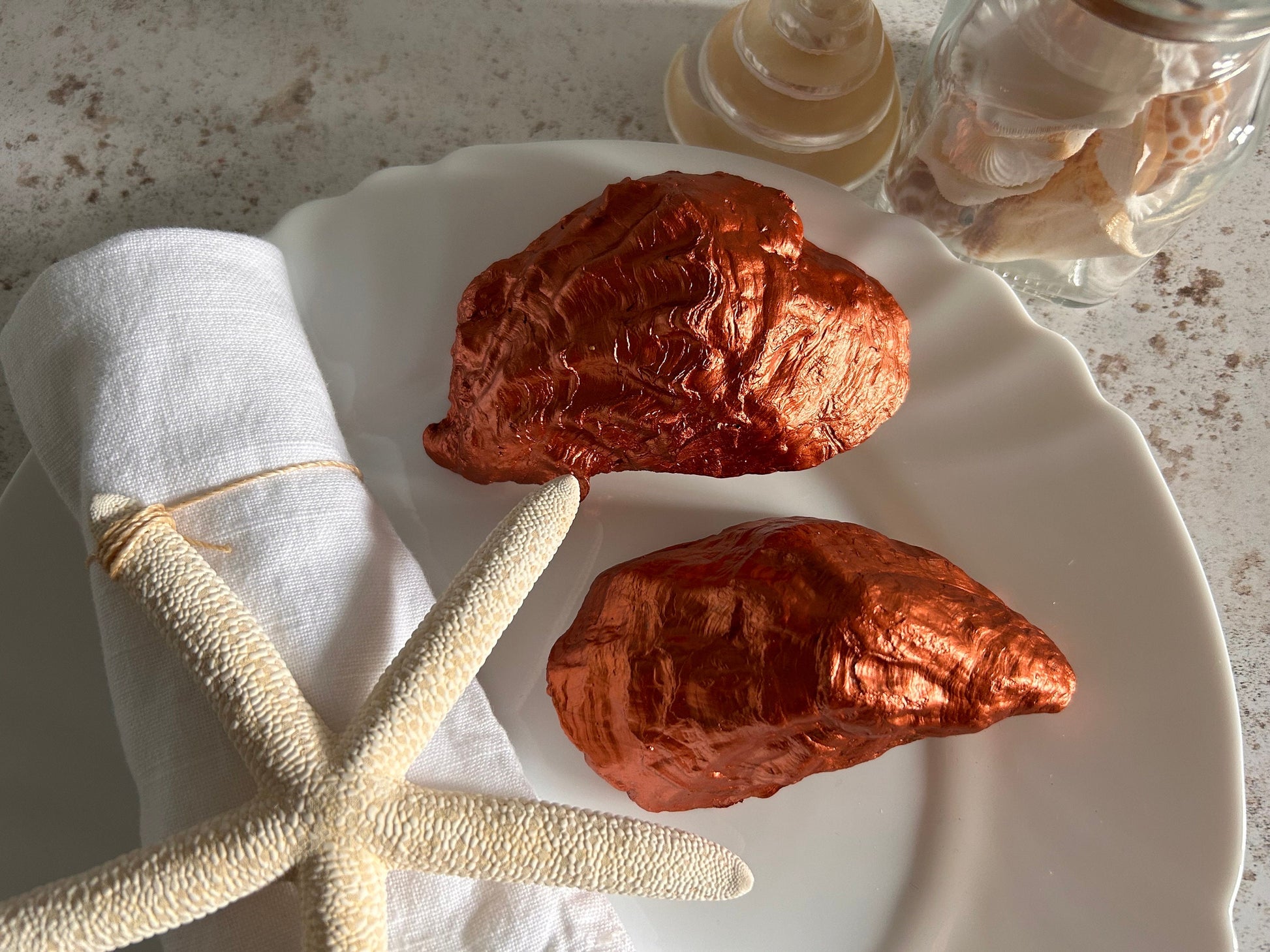 Copper oyster shell wedding favour and name place.