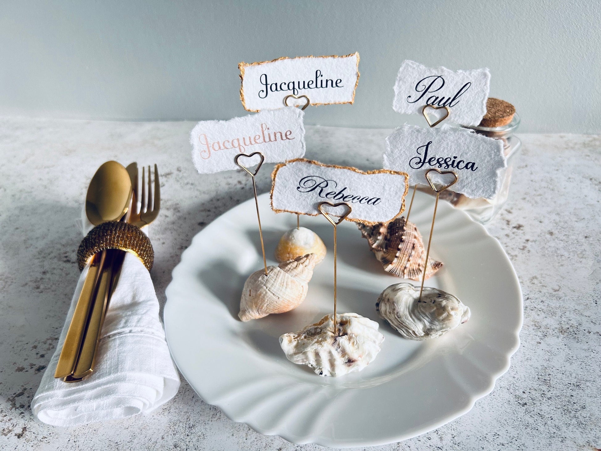 Personalised shell name cards. Seashell name card holder. Gold edged hand torn place names. Destination wedding shell guest name and favor.