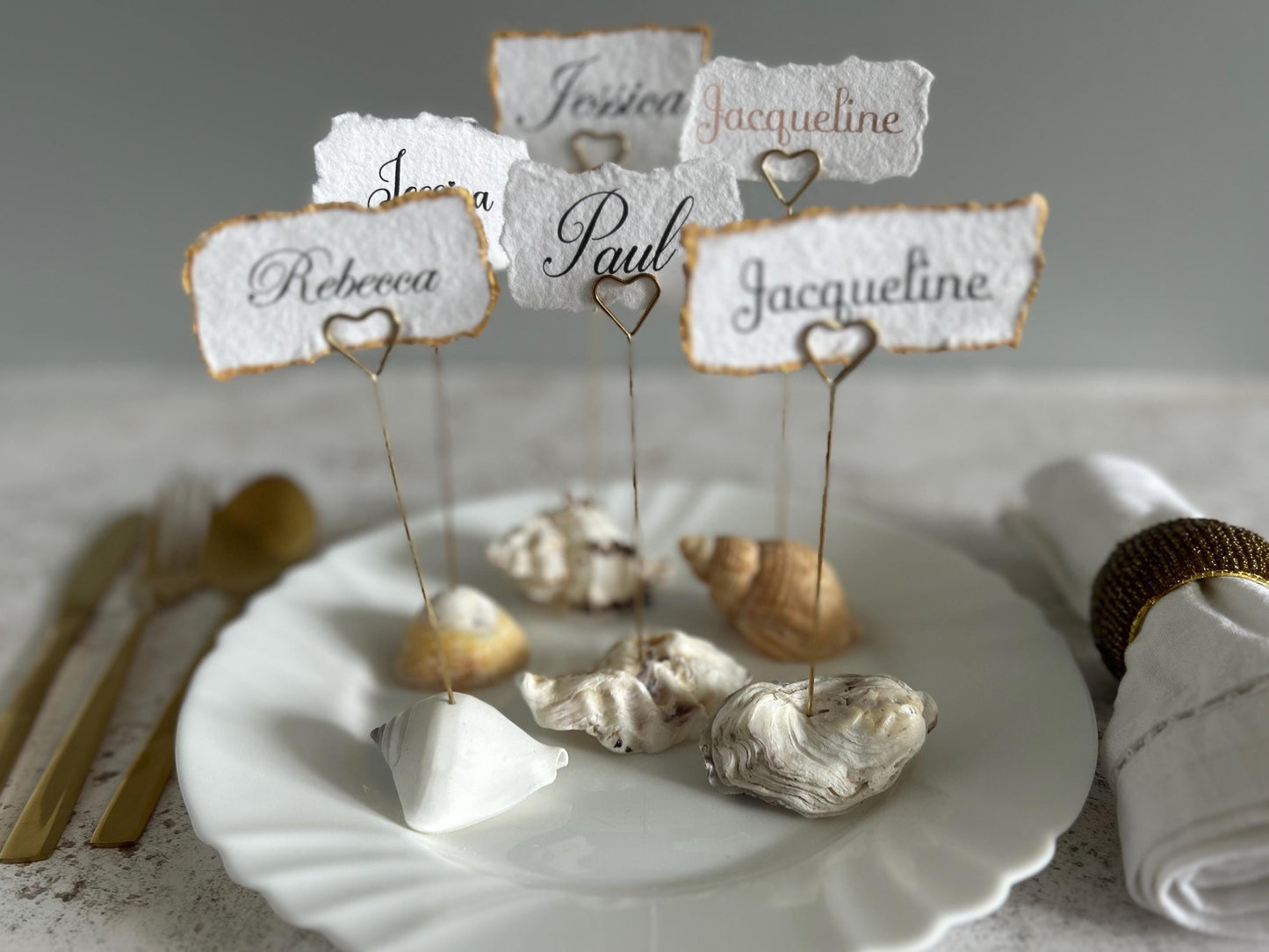 Personalised shell name cards. Seashell name card holder. Gold edged hand torn place names. Destination wedding shell guest name and favor.