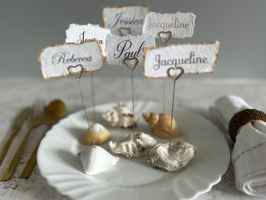 Personalised shell name cards. Seashell name card holder. Gold edged hand torn place names. Destination wedding shell guest name and favor.