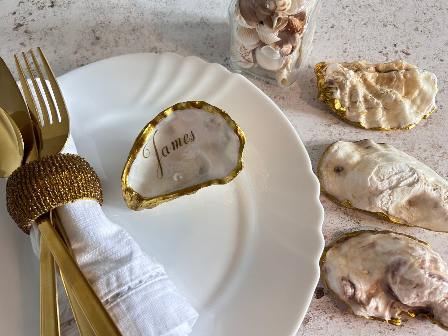 personalised Antique gold-rimmed oyster shells.