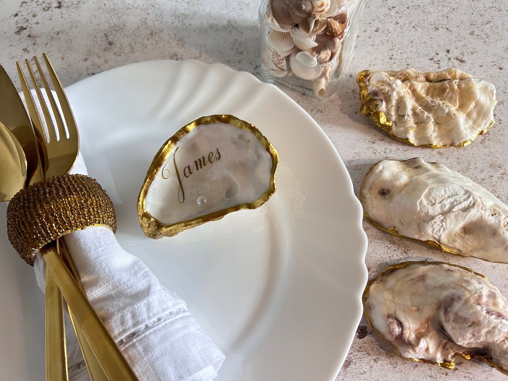 personalised Antique gold-rimmed oyster shells.