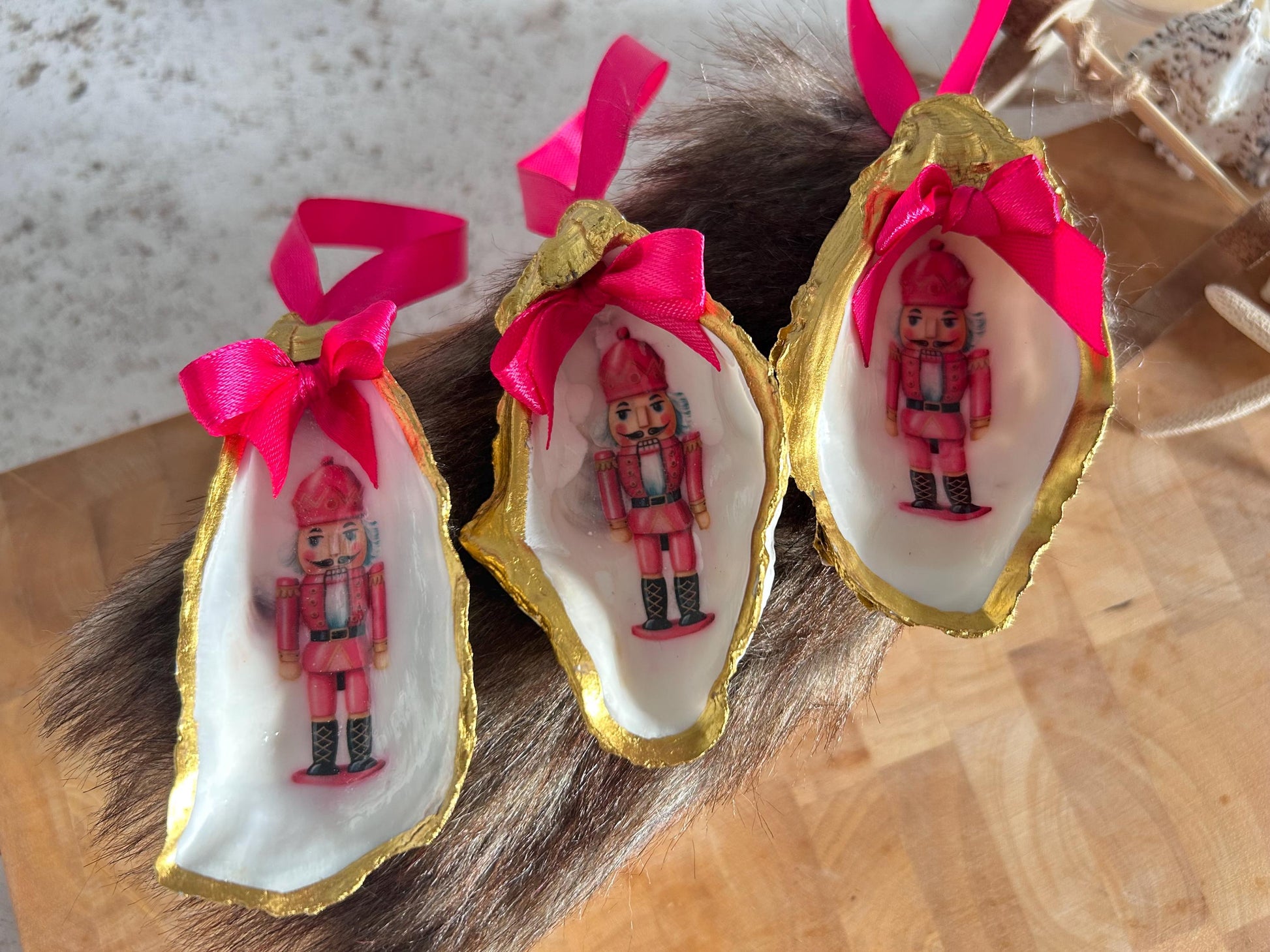 Pink Retro Nutcracker Oyster Shell Ornament. Gold and Cerise Handcrafted Christmas Bauble.