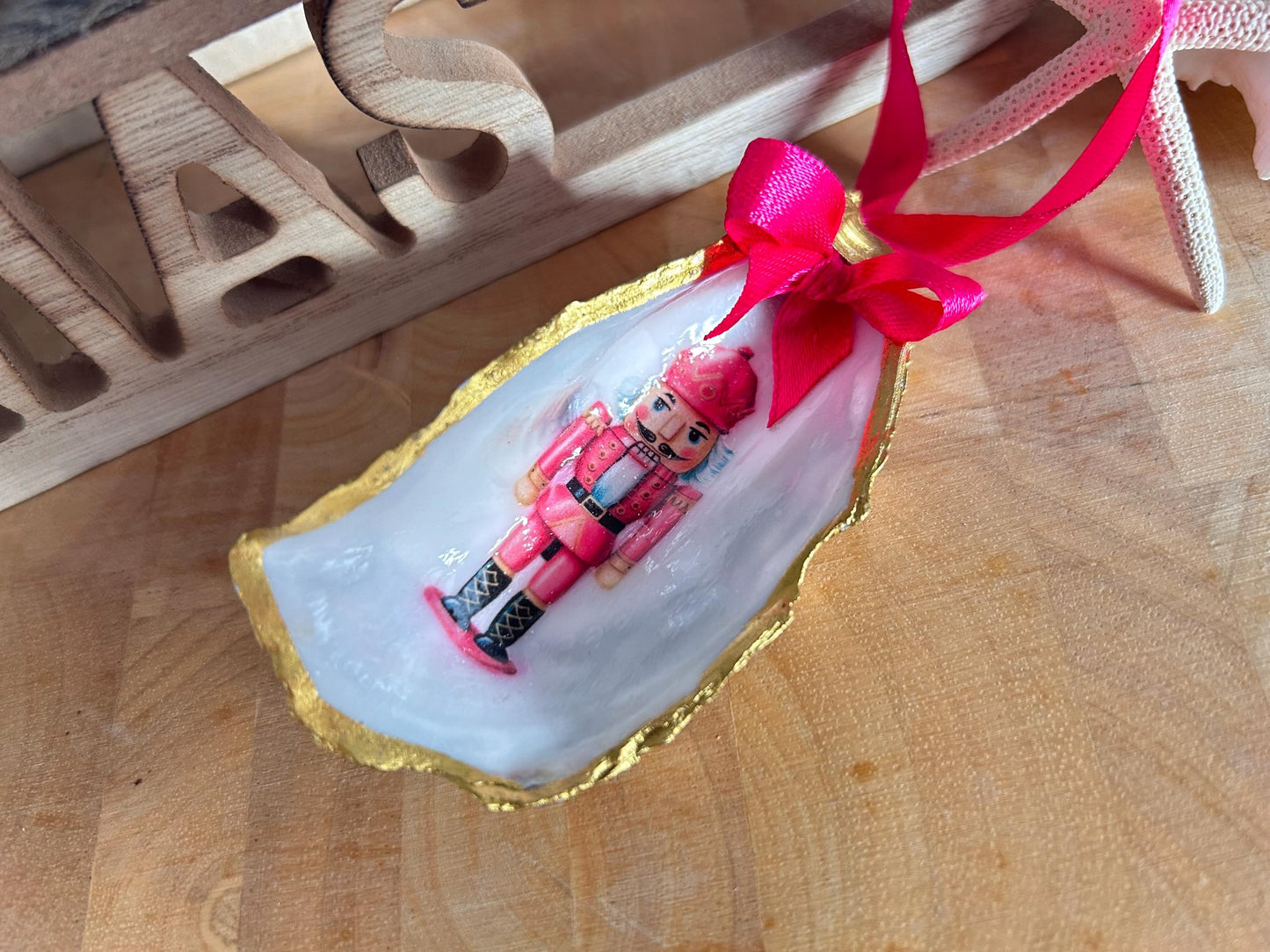Pink Retro Nutcracker Oyster Shell Ornament. Gold and Cerise Handcrafted Christmas Bauble.