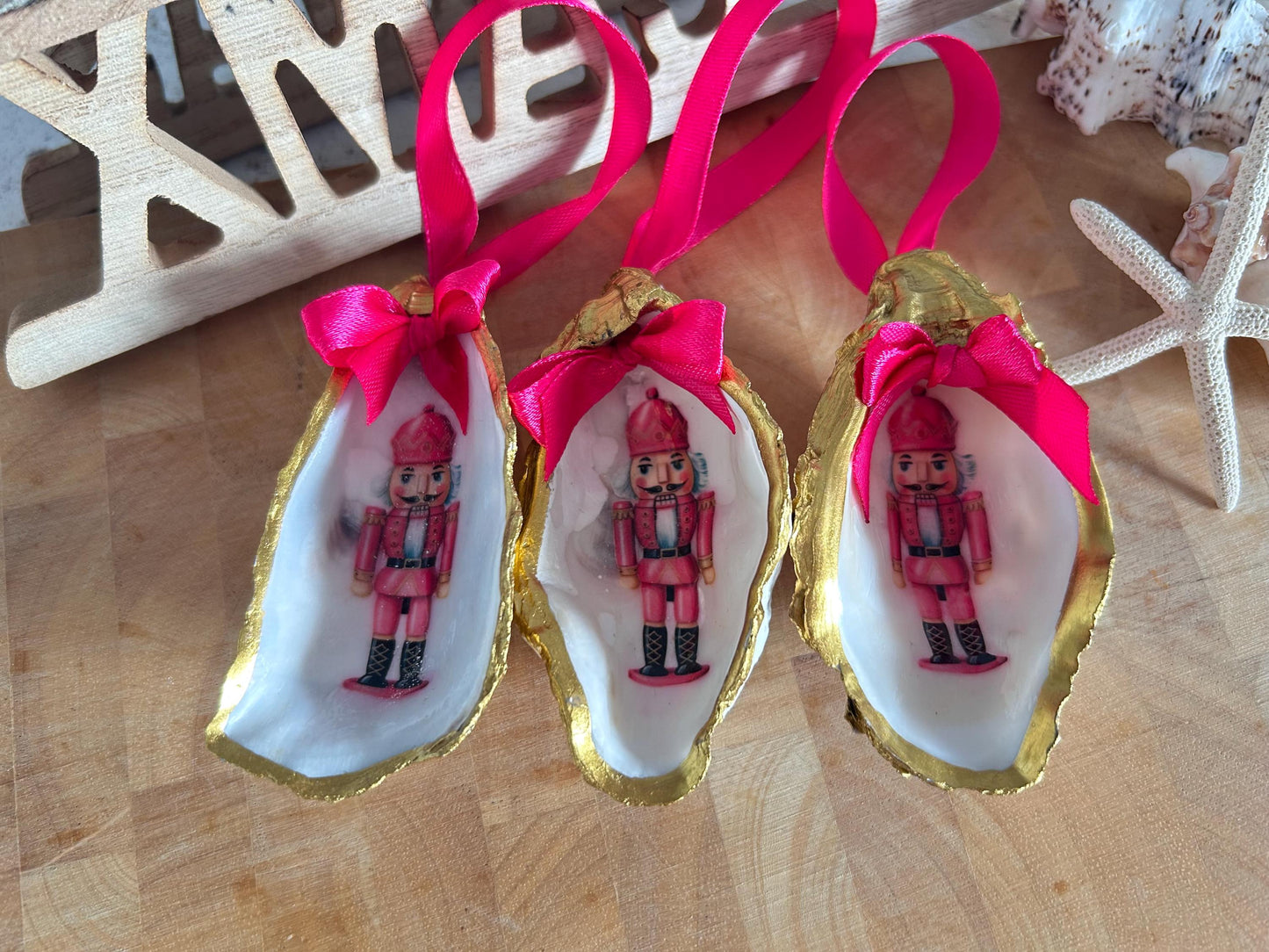 Pink Retro Nutcracker Oyster Shell Ornament. Gold and Cerise Handcrafted Christmas Bauble.