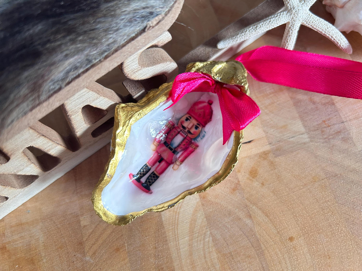 Pink Retro Nutcracker Oyster Shell Ornament. Gold and Cerise Handcrafted Christmas Bauble.