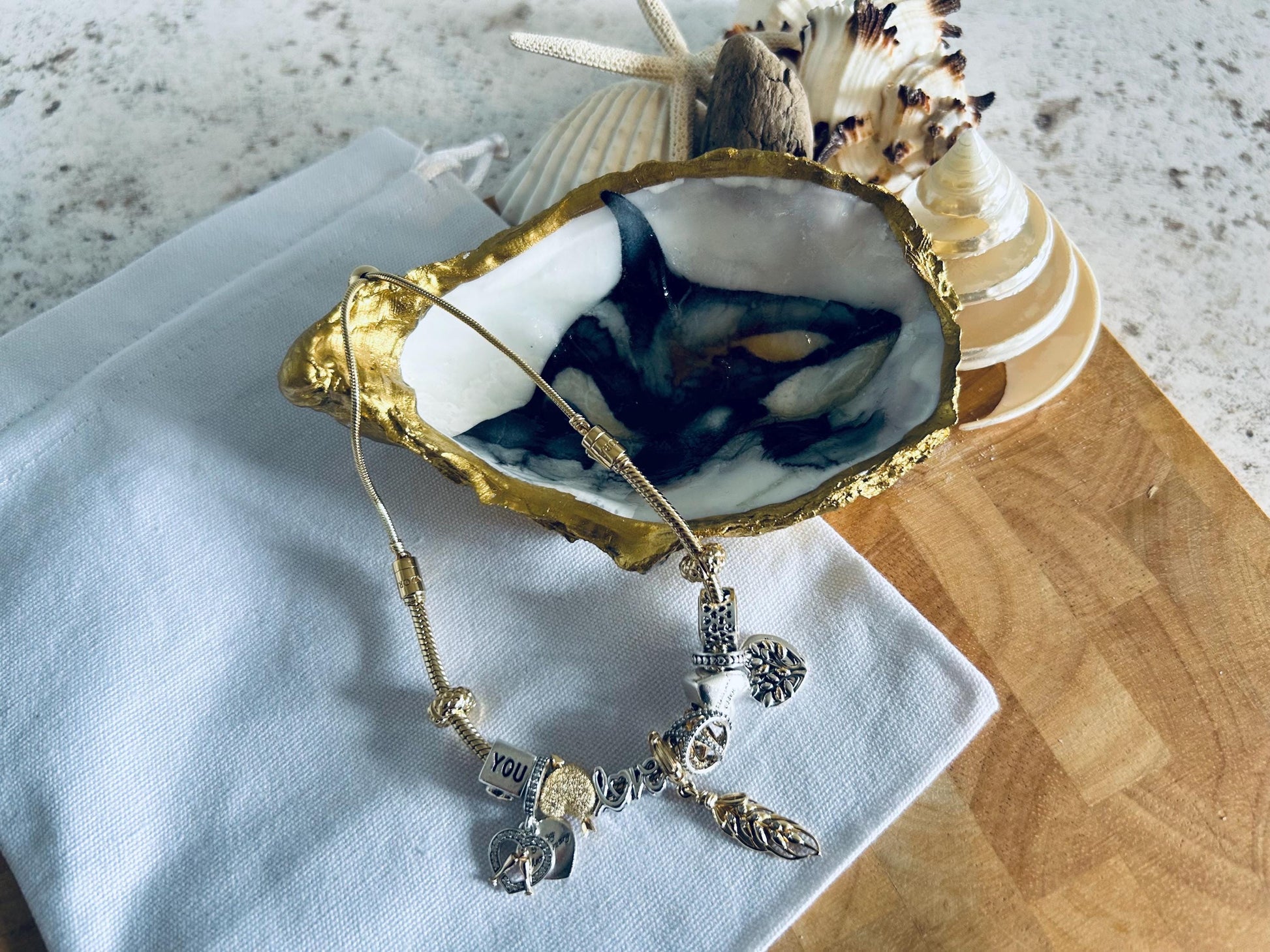 Killer whale oyster shell dish. Orca desk tidy gift for a sea life lover. Marine animal natural shell dish. Gold and Black sea shell dish.