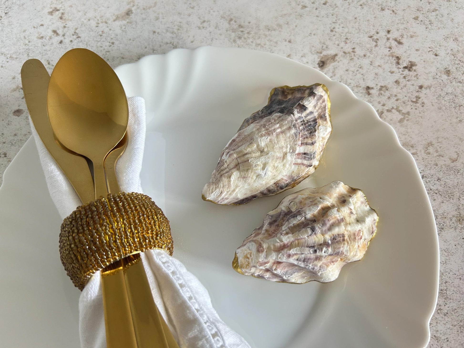 These oyster shells ore left natural on the inside and underside.