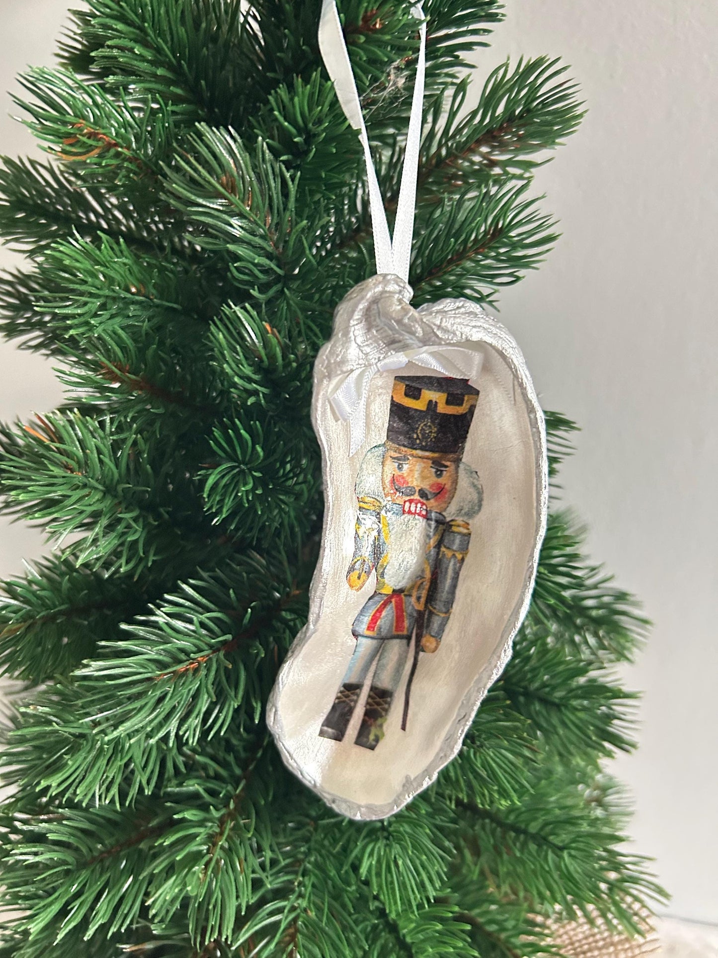 Nutcracker Christmas Tree Ornament. Silver Oyster Shell Holiday Decoration.