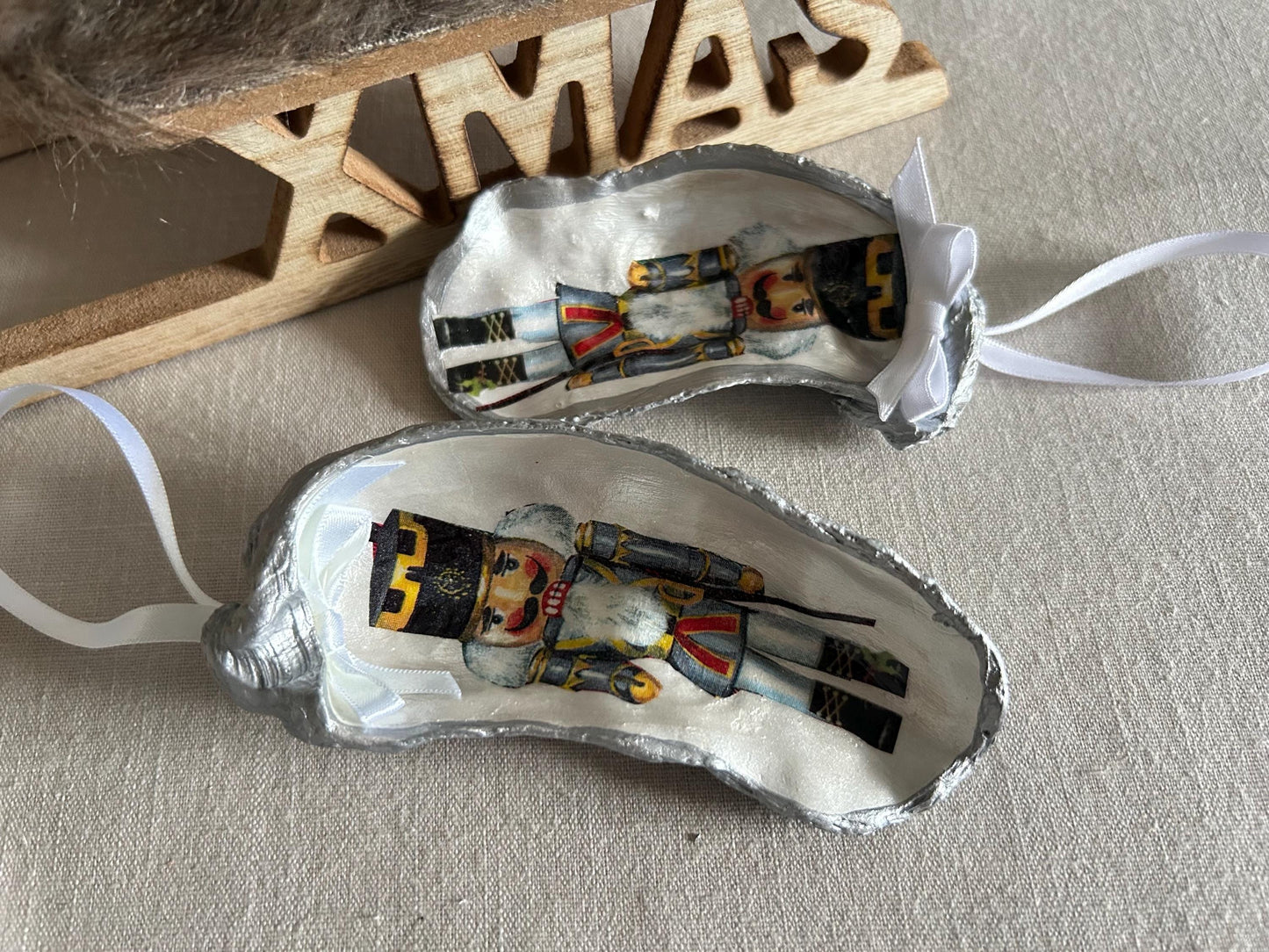 Nutcracker Christmas Tree Ornament. Silver Oyster Shell Holiday Decoration.