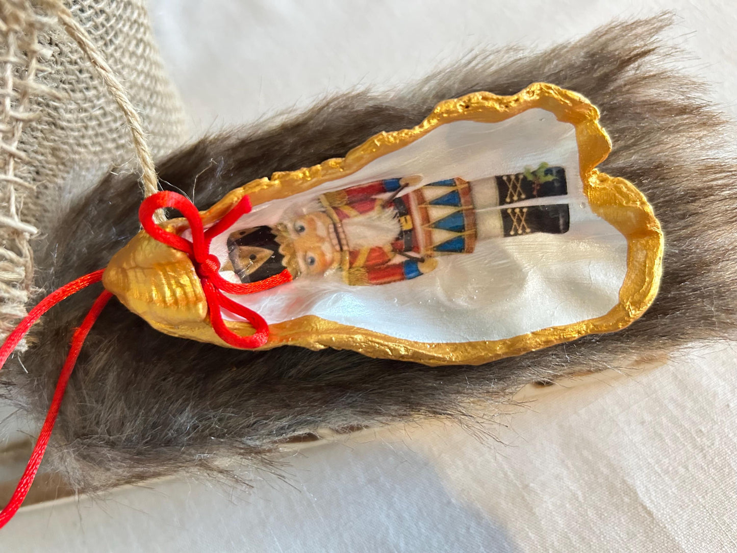 Nutcracker Oyster Shell Hanging Bauble. Festive Gold Christmas Soldier Tree Decoration.