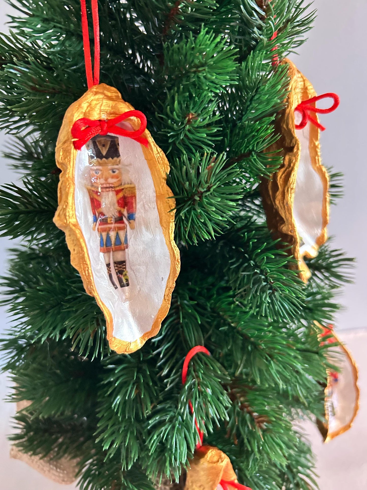 Nutcracker Oyster Shell Hanging Bauble. Festive Gold Christmas Soldier Tree Decoration.