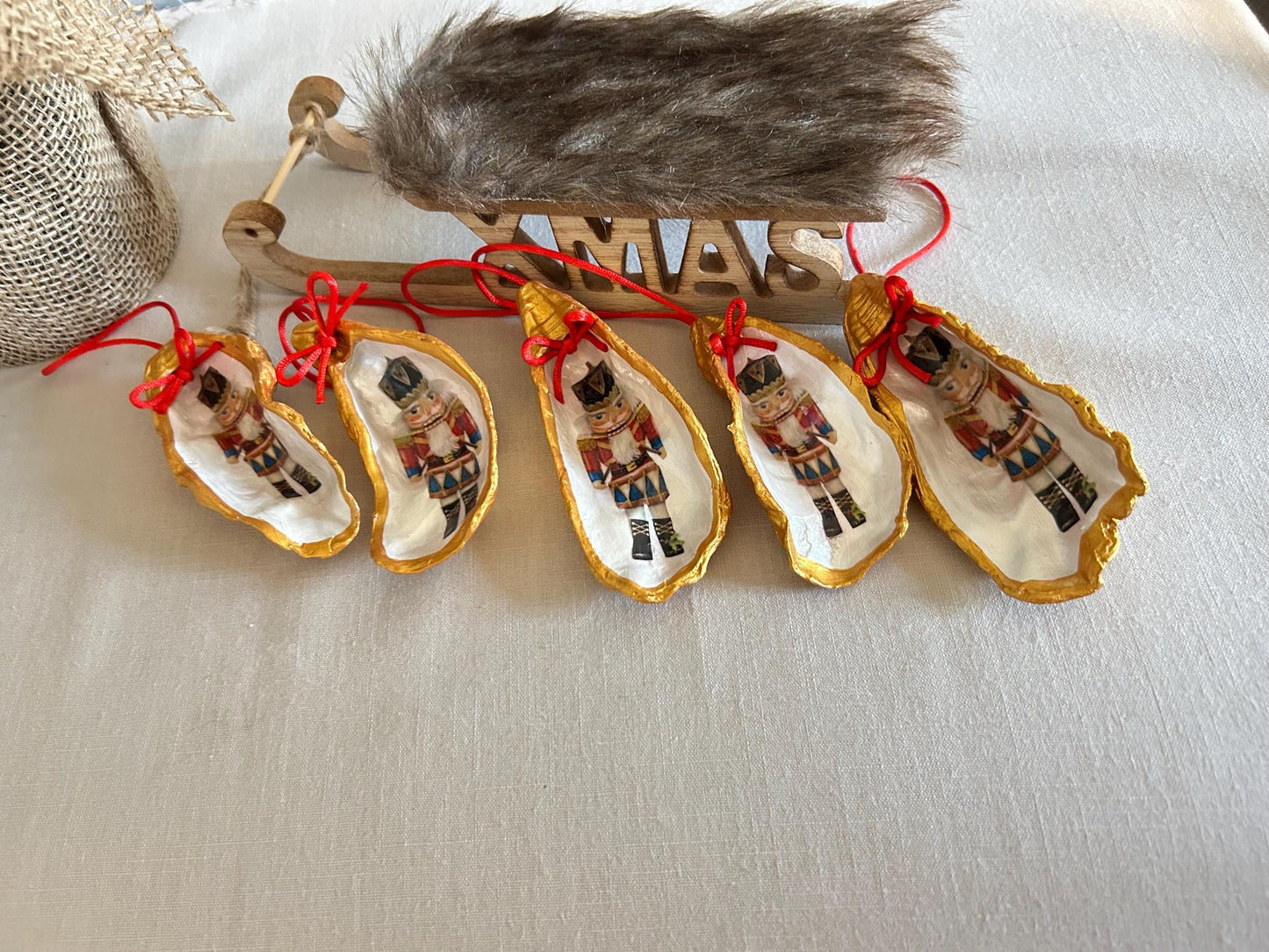 Nutcracker Oyster Shell Hanging Bauble. Festive Gold Christmas Soldier Tree Decoration.