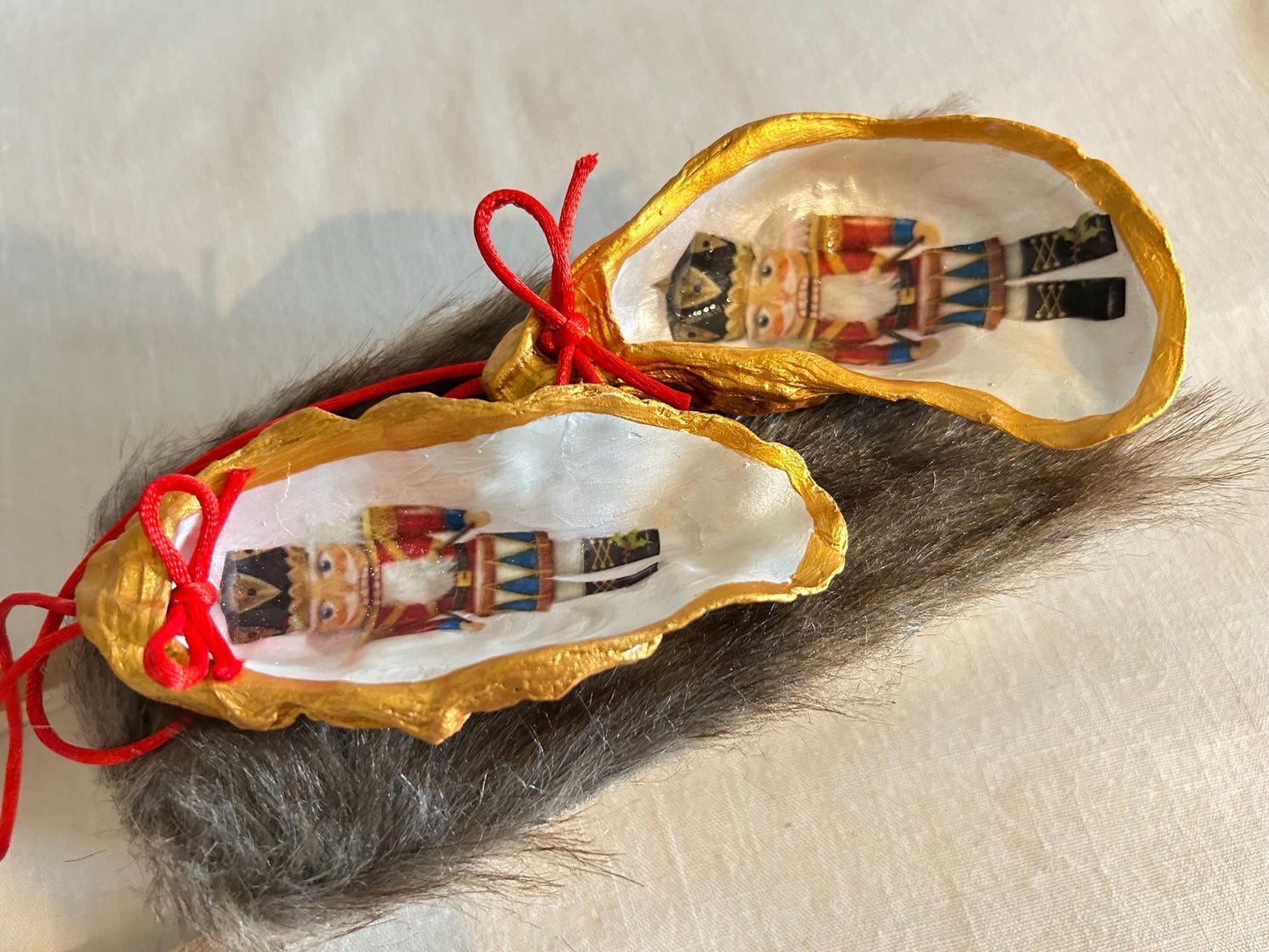 Nutcracker Oyster Shell Hanging Bauble. Festive Gold Christmas Soldier Tree Decoration.