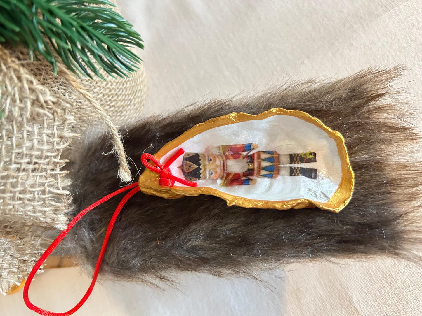 Nutcracker Oyster Shell Hanging Bauble. Festive Gold Christmas Soldier Tree Decoration.