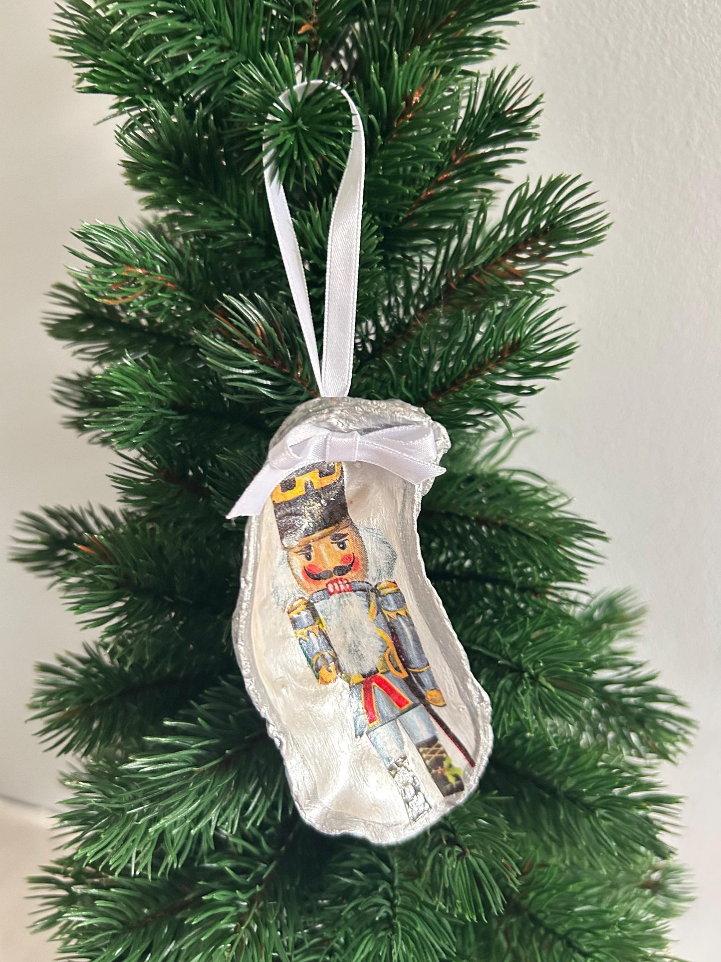 Nutcracker Christmas Tree Ornament. Silver Oyster Shell Holiday Decoration.