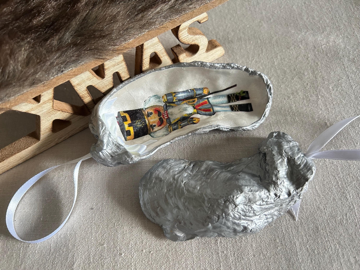 Nutcracker Christmas Tree Ornament. Silver Oyster Shell Holiday Decoration.