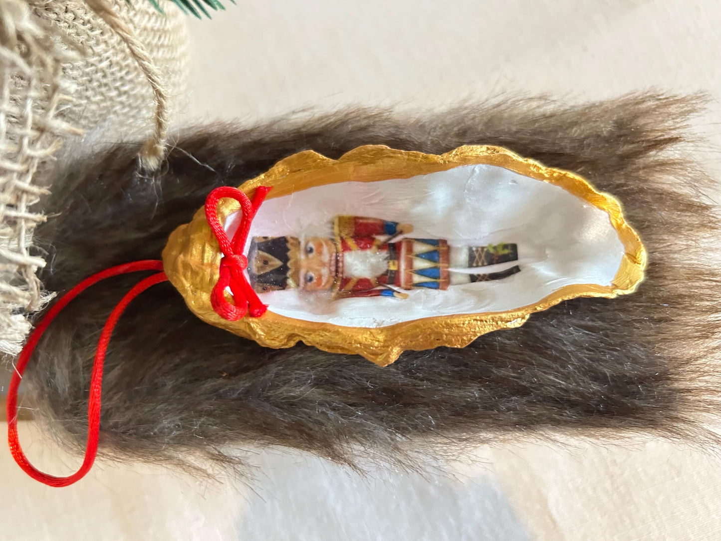 Nutcracker Oyster Shell Hanging Bauble. Festive Gold Christmas Soldier Tree Decoration.