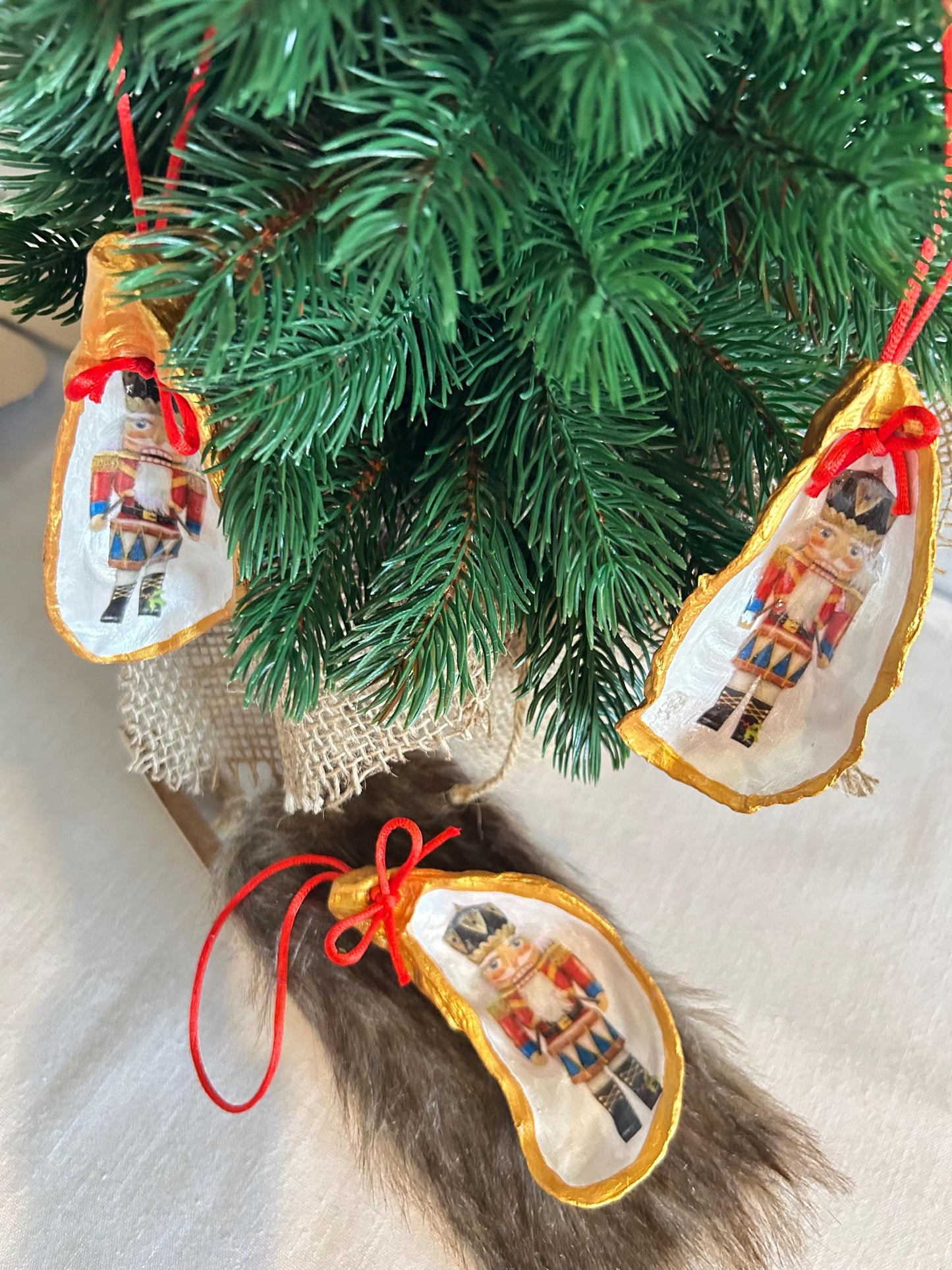Nutcracker Oyster Shell Hanging Bauble. Festive Gold Christmas Soldier Tree Decoration.