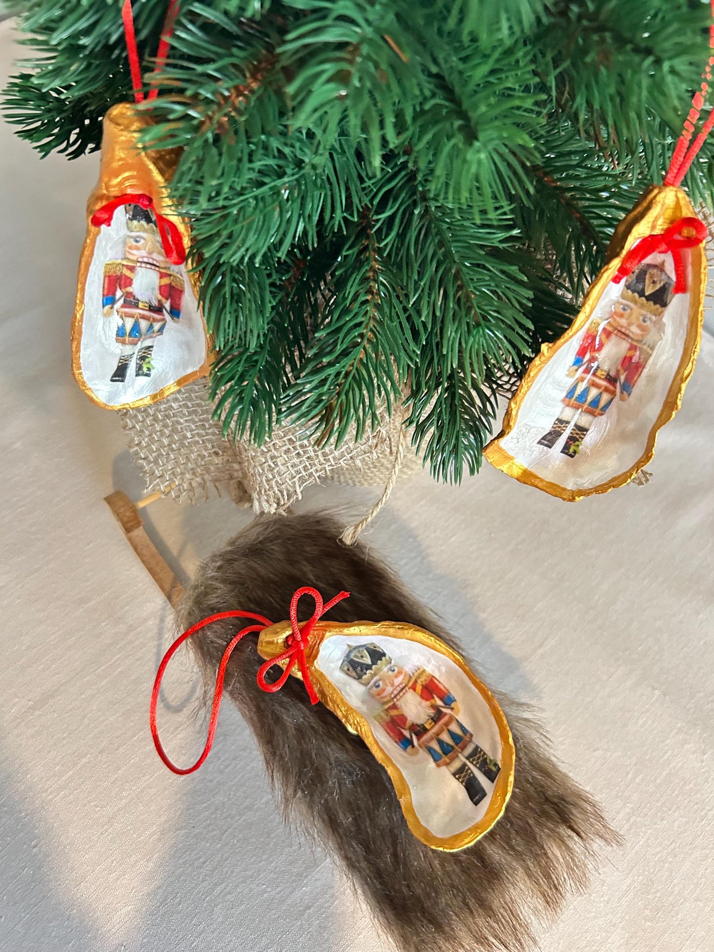 Nutcracker Oyster Shell Hanging Bauble. Festive Gold Christmas Soldier Tree Decoration.